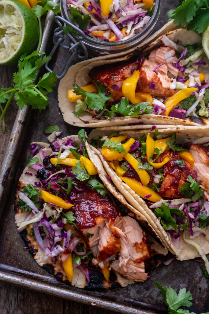 Honey BBQ Salmon Tacos with Mango Slaw