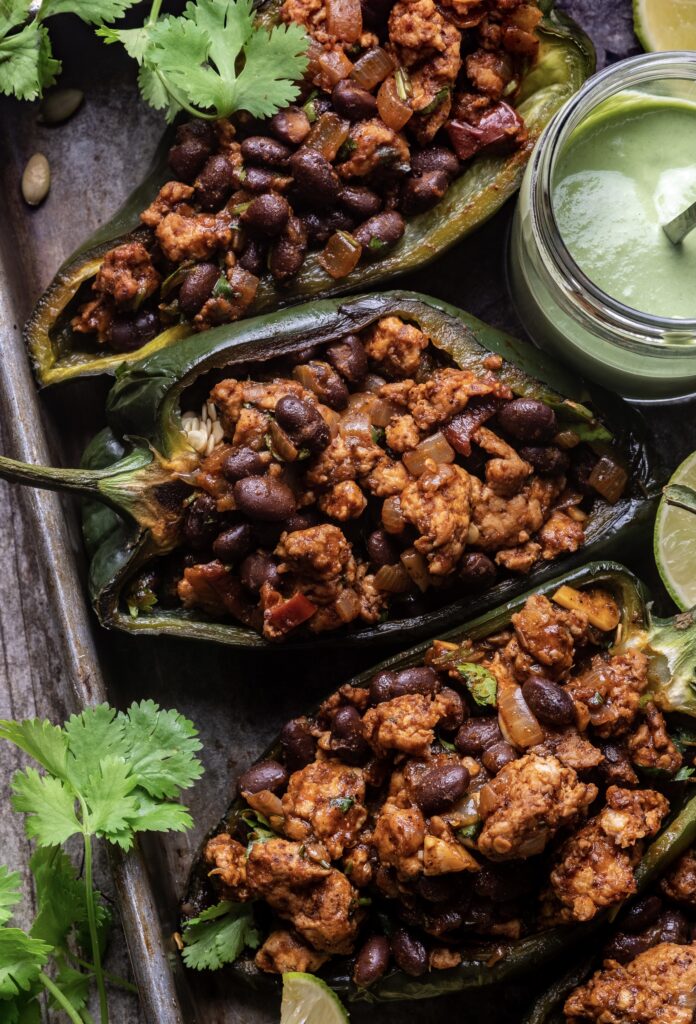 Chipotle Chicken Stuffed Poblano Peppers with Pumpkin Seed Crema